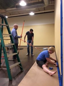 The team at Caio Terra Academy Madison plans a surprise birthday present for head instructor Jordan Wilson. We painted the entire space overnight. 